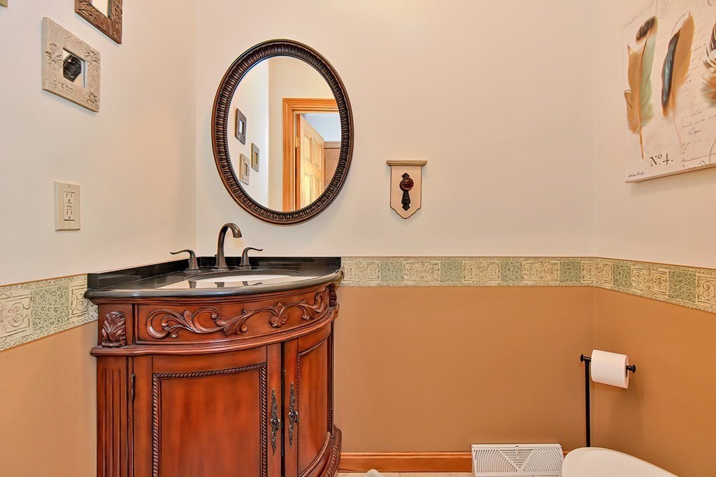 2 Harrison Place Franklin, MA 02038 - Photo 15 of 34 a bathroom with a sink and a mirror