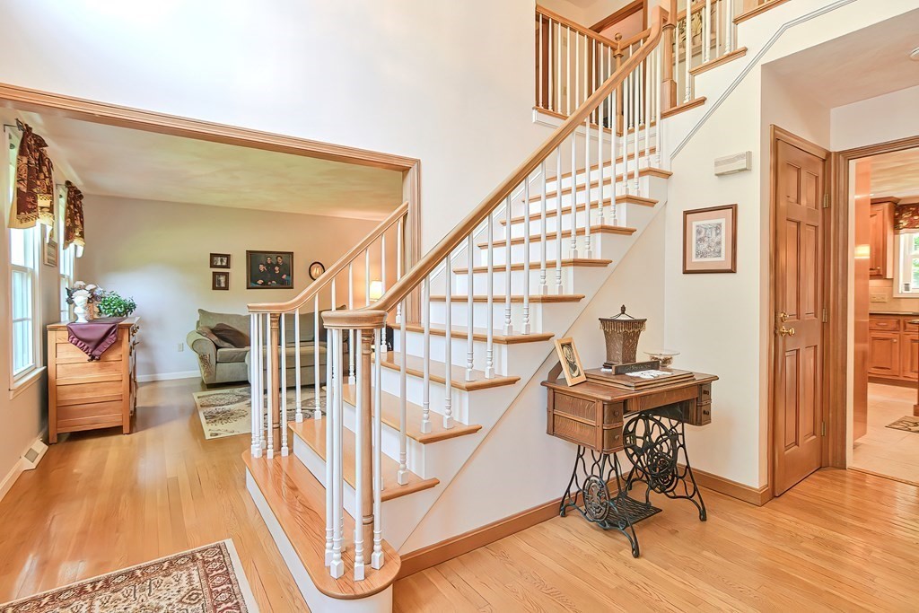 2 Harrison Place Franklin, MA 02038 - Photo 2 of 34 a view of entryway with wooden floor and stairs