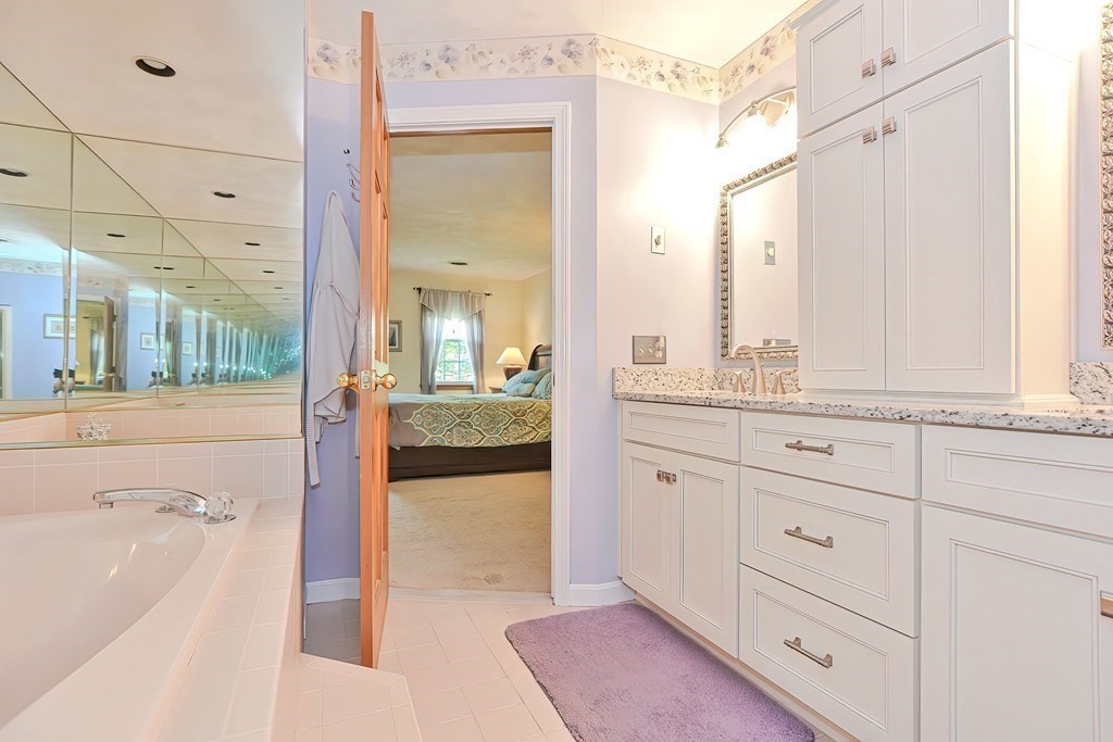 2 Harrison Place Franklin, MA 02038 - Photo 22 of 34 a spacious bathroom with a tub sink and mirror
