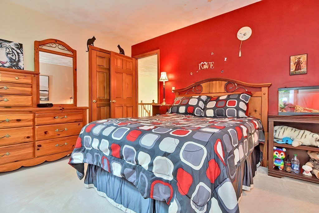 2 Harrison Place Franklin, MA 02038 - Photo 23 of 34 a bedroom with a bed and a dresser