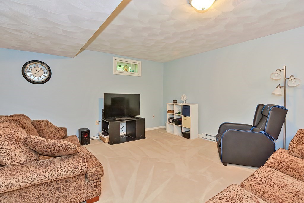 2 Harrison Place Franklin, MA 02038 - Photo 28 of 34 a bedroom with a bed and a television