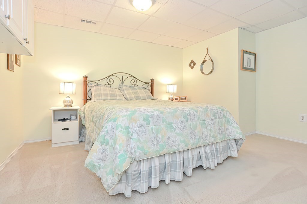 2 Harrison Place Franklin, MA 02038 - Photo 29 of 34 a bedroom with a bed and lamp