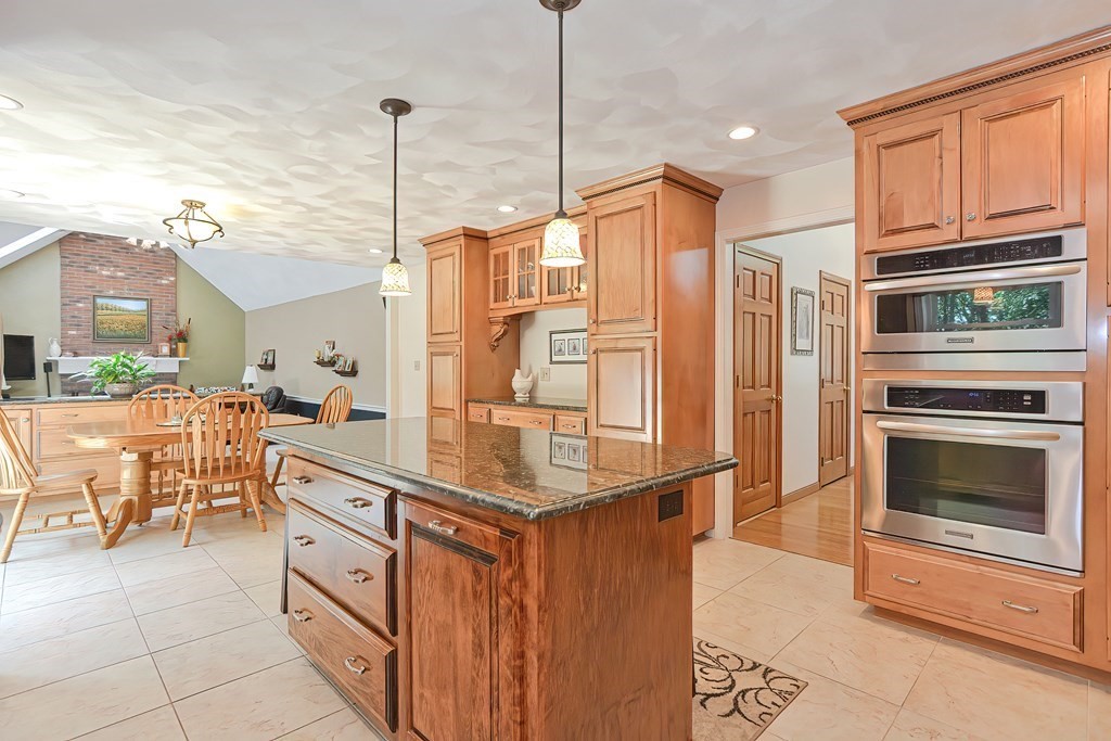 2 Harrison Place Franklin, MA 02038 - Photo 9 of 34 a kitchen with stainless steel appliances granite countertop a stove a sink and a refrigerator