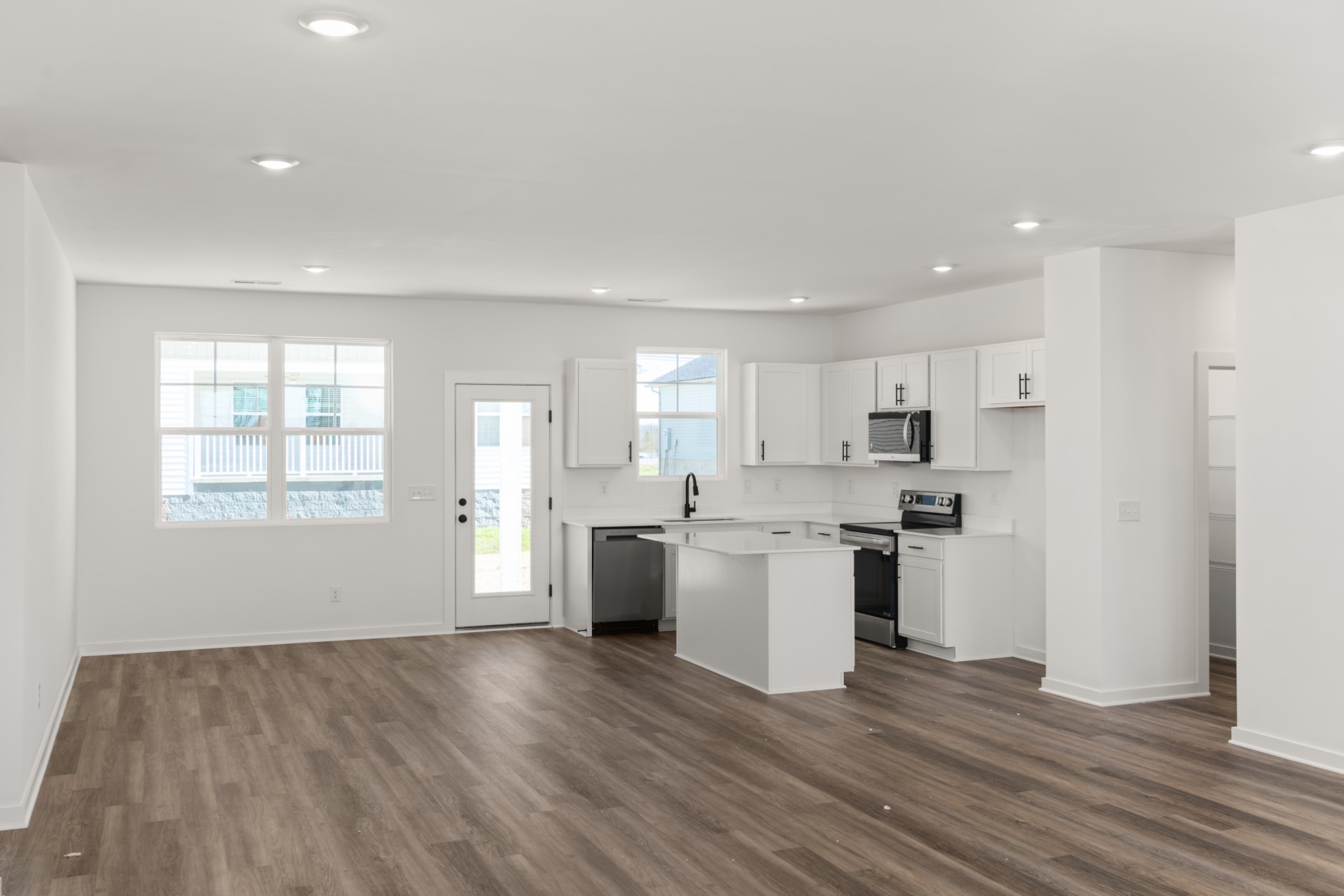 219 Reece Road Baxter, TN 38544 - Photo 10 of 10 a kitchen with a white wooden cabinets and stove top oven