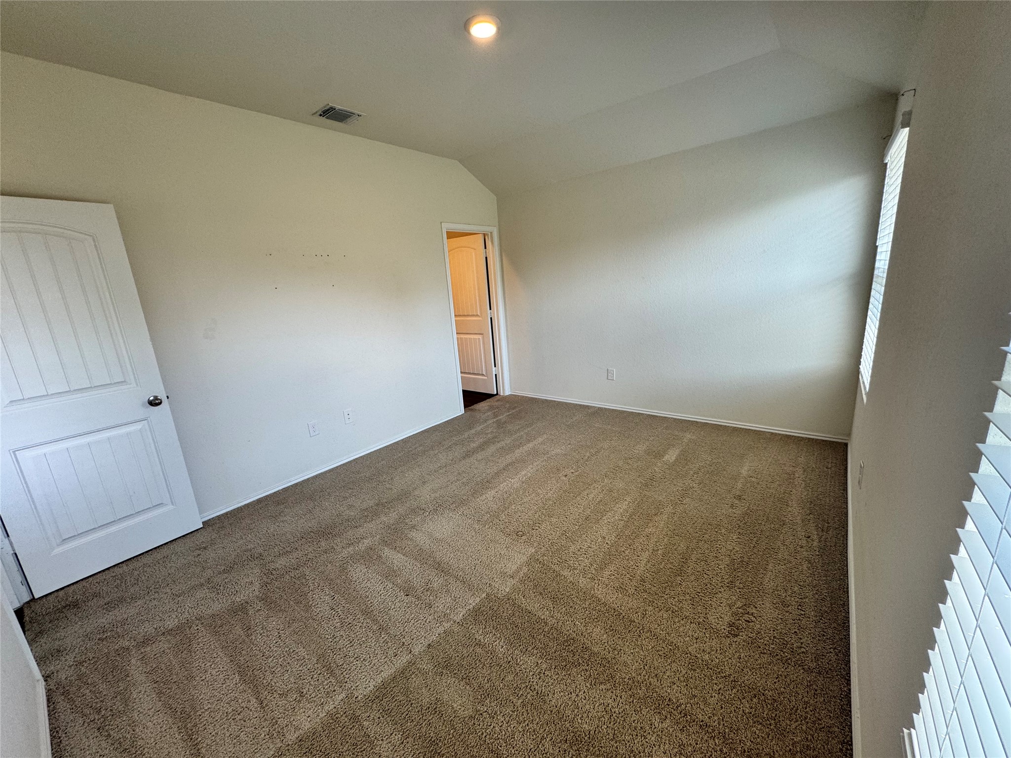 11820 Rush Lane Elgin, TX 78621 - Photo 28 of 31 A well-lit, neutral-toned room ready for personalized touches.