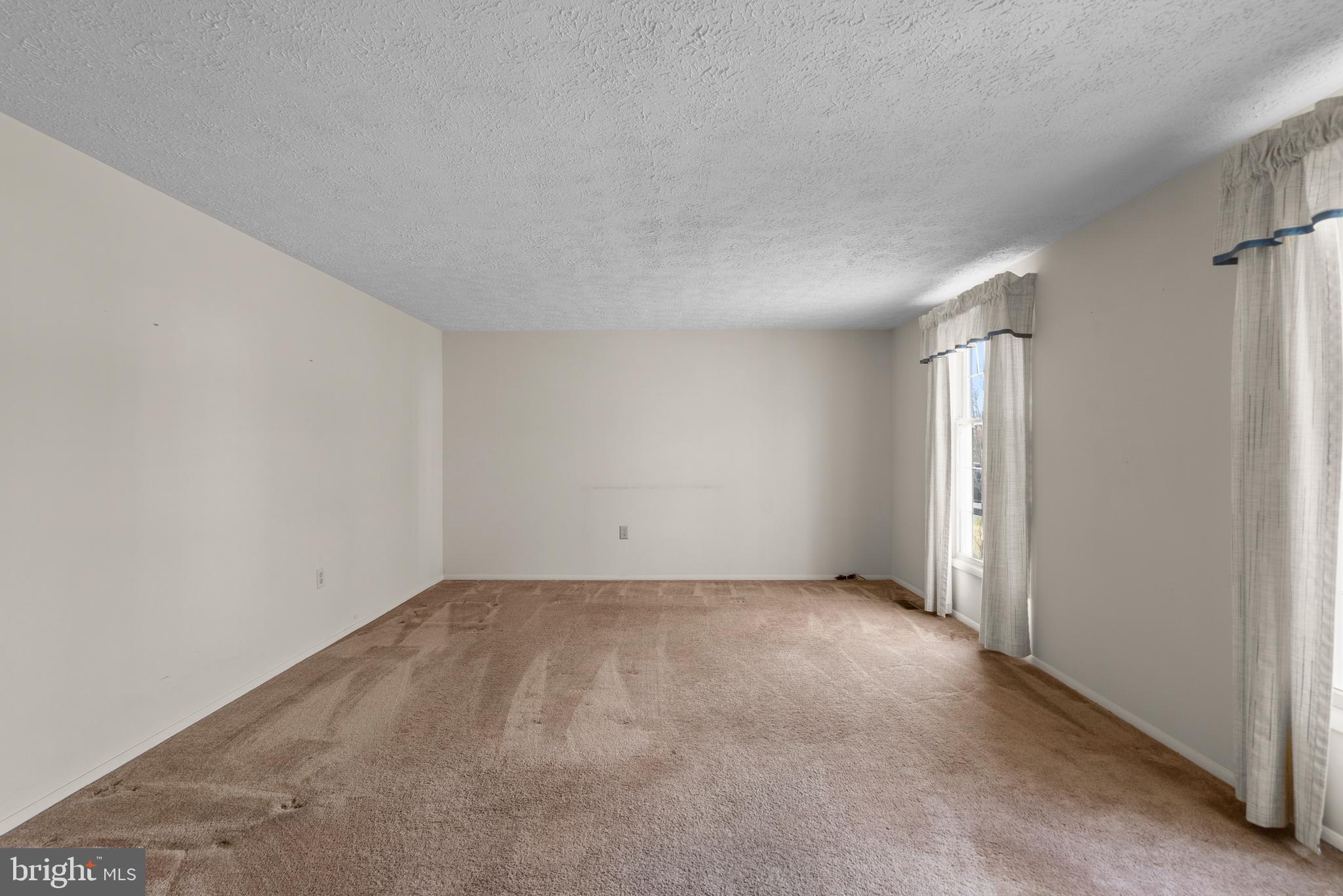 8745 Cardinal Forest Circle Laurel, MD 20723 - Photo 14 of 43 an empty room with a empty space and windows