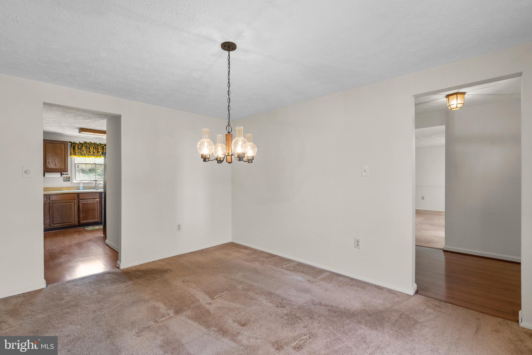 8745 Cardinal Forest Circle Laurel, MD 20723 - Photo 18 of 43 a view of a room with a chandelier fan and windows
