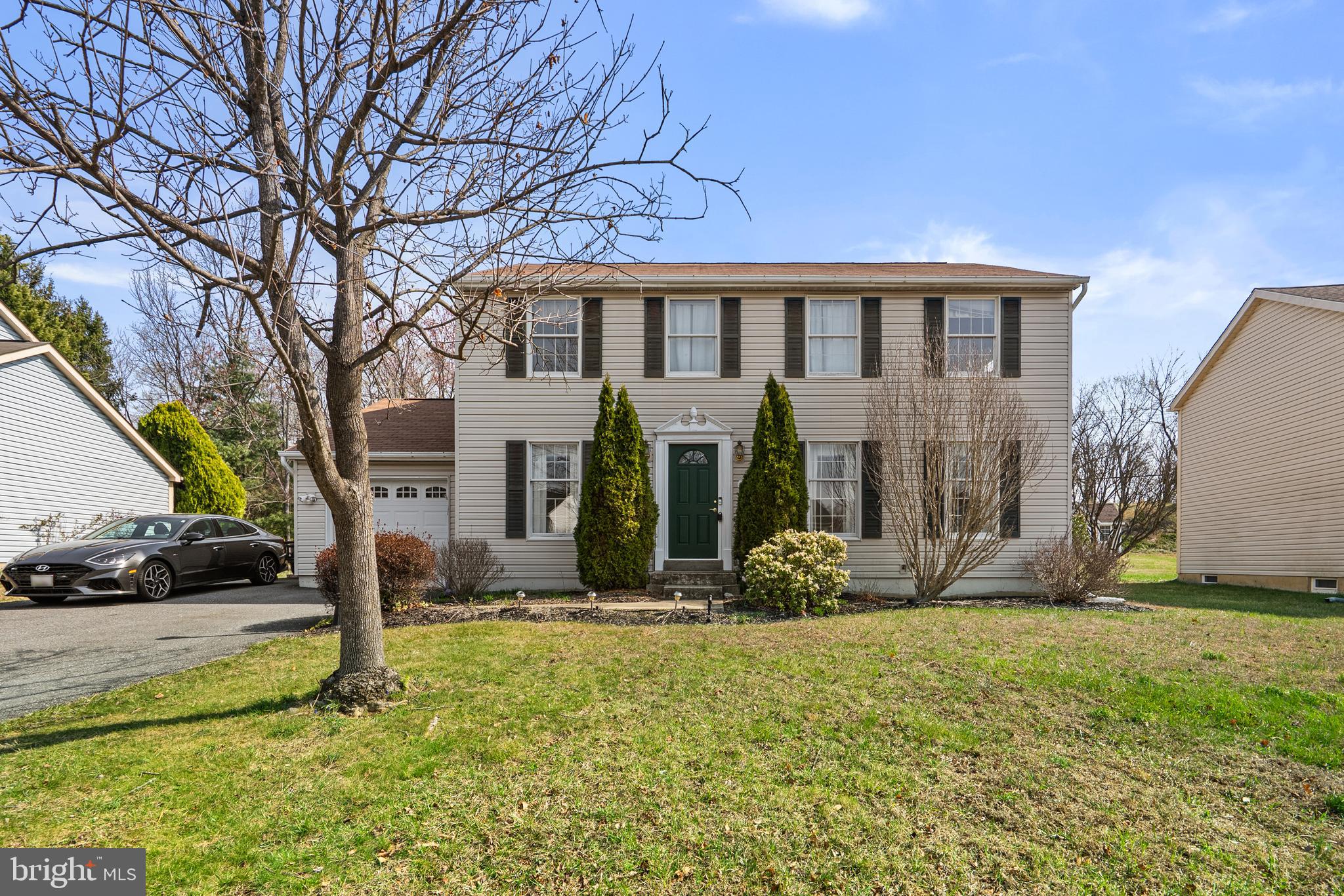 8745 Cardinal Forest Circle Laurel, MD 20723 - Photo 2 of 43 a front view of a house with garden