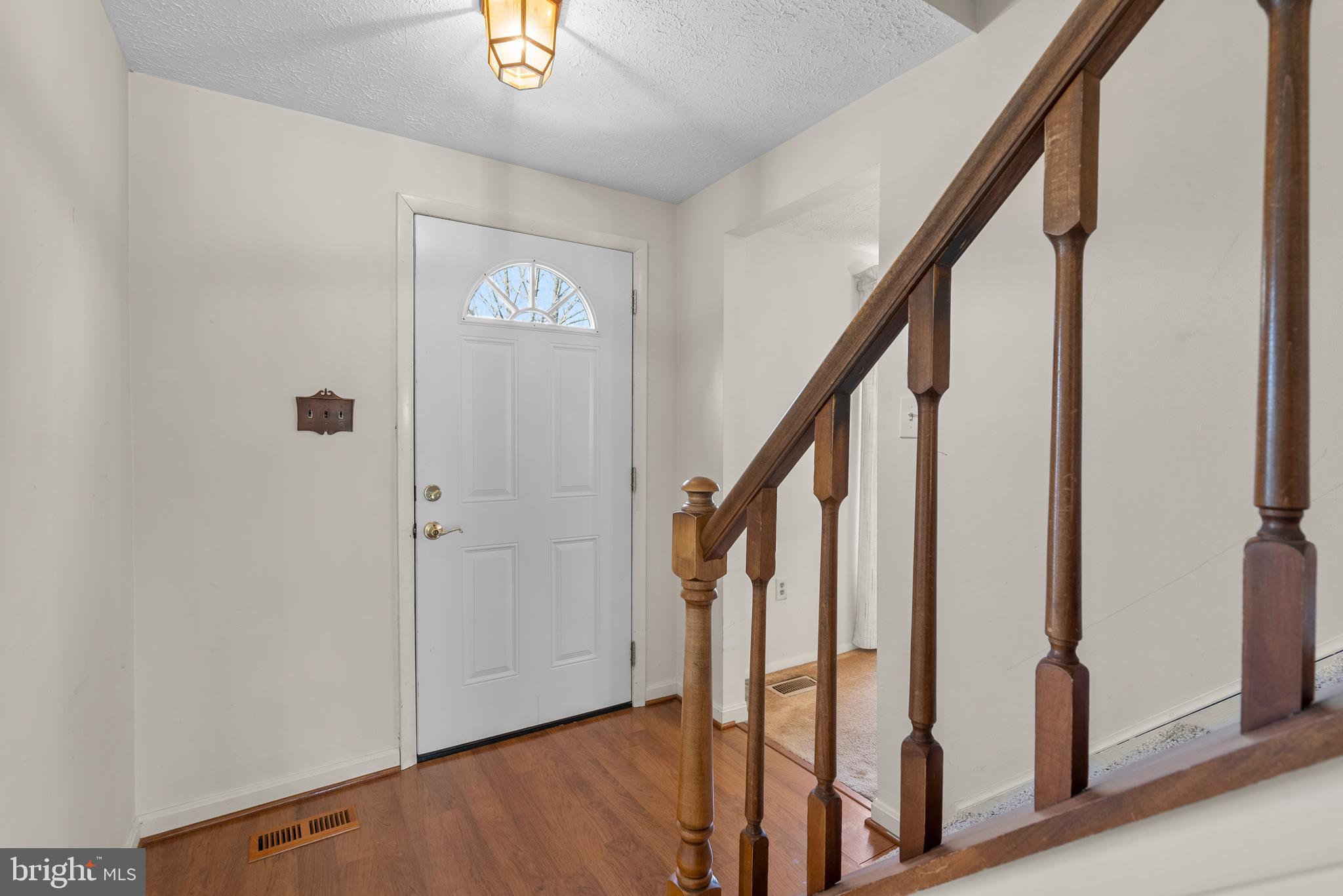 8745 Cardinal Forest Circle Laurel, MD 20723 - Photo 4 of 43 a view of an entryway with wooden floor