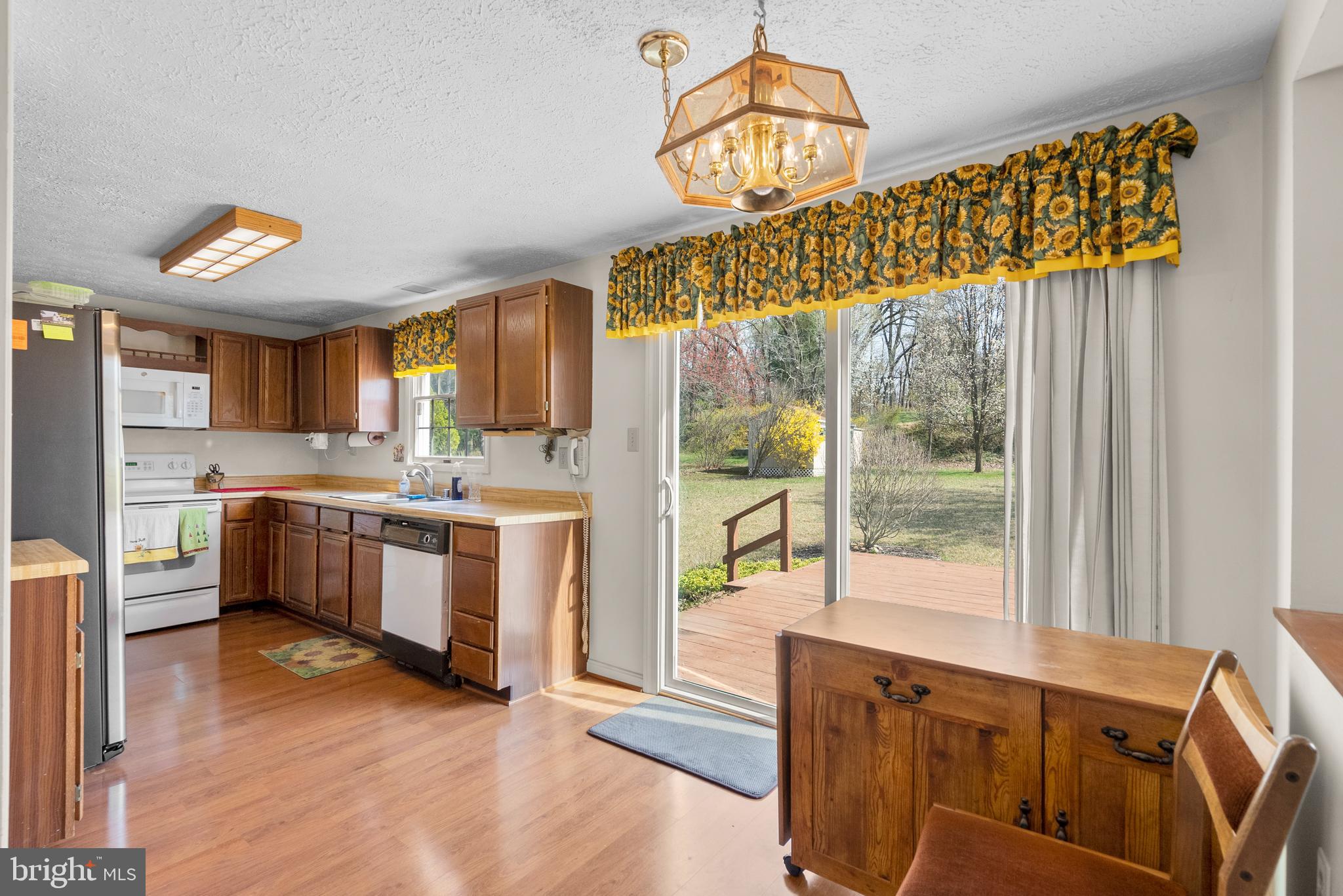8745 Cardinal Forest Circle Laurel, MD 20723 - Photo 10 of 43 a kitchen with stainless steel appliances granite countertop a stove and a wooden floors