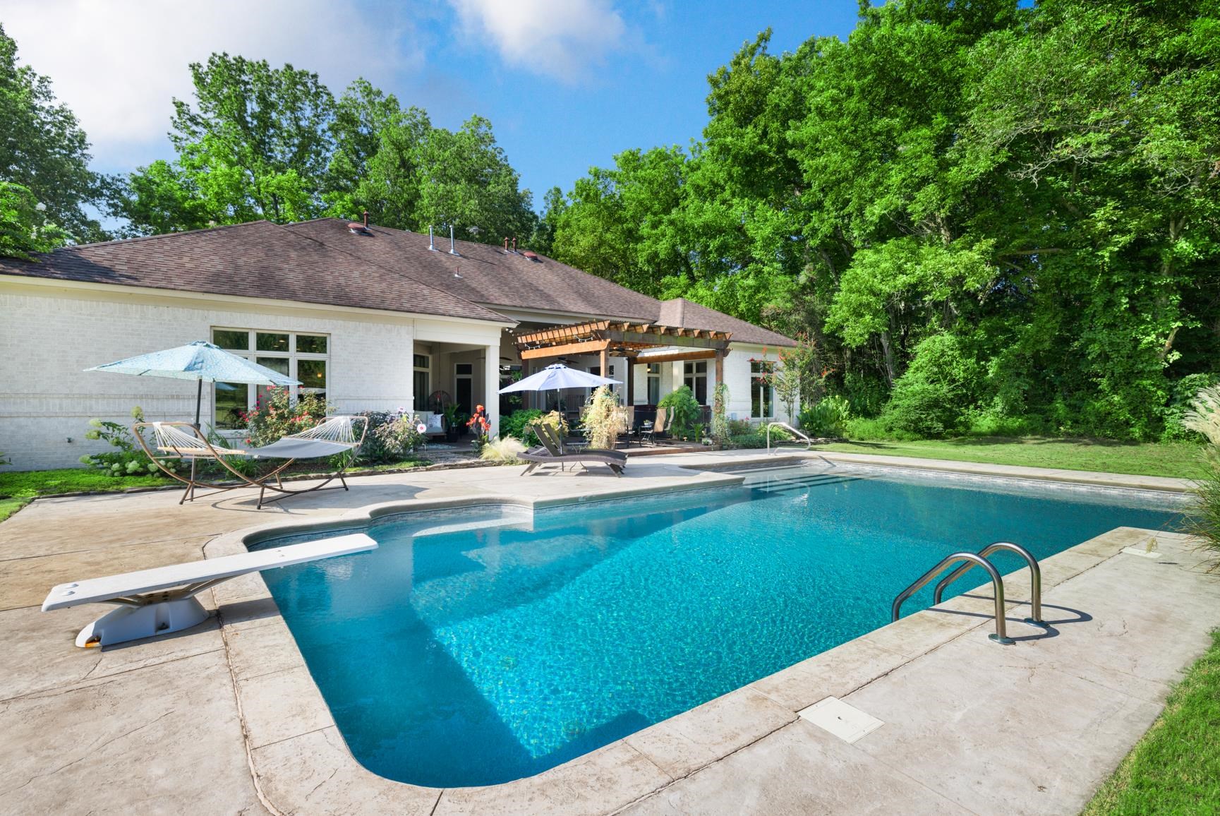746 Kelly Corner Road Covington, TN 38019 - Photo 32 of 40 View of pool featuring a patio, a pergola, and a diving board
