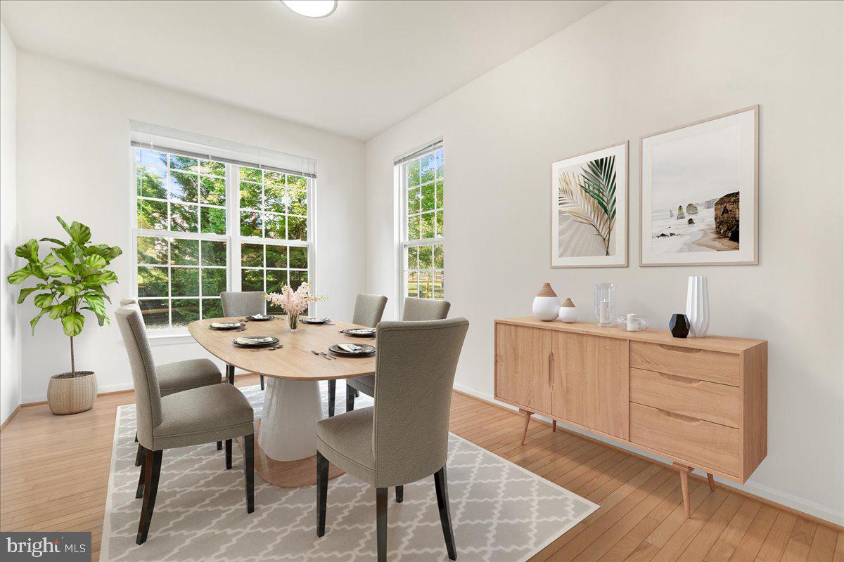 1712 Wheyfield Drive Frederick, MD 21701 - Photo 13 of 64 a view of a dining room with furniture and window