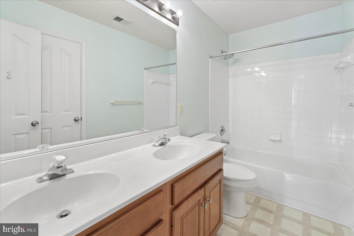 1712 Wheyfield Drive Frederick, MD 21701 - Photo 22 of 64 a bathroom with a sink double vanity granite tub shower and a mirror