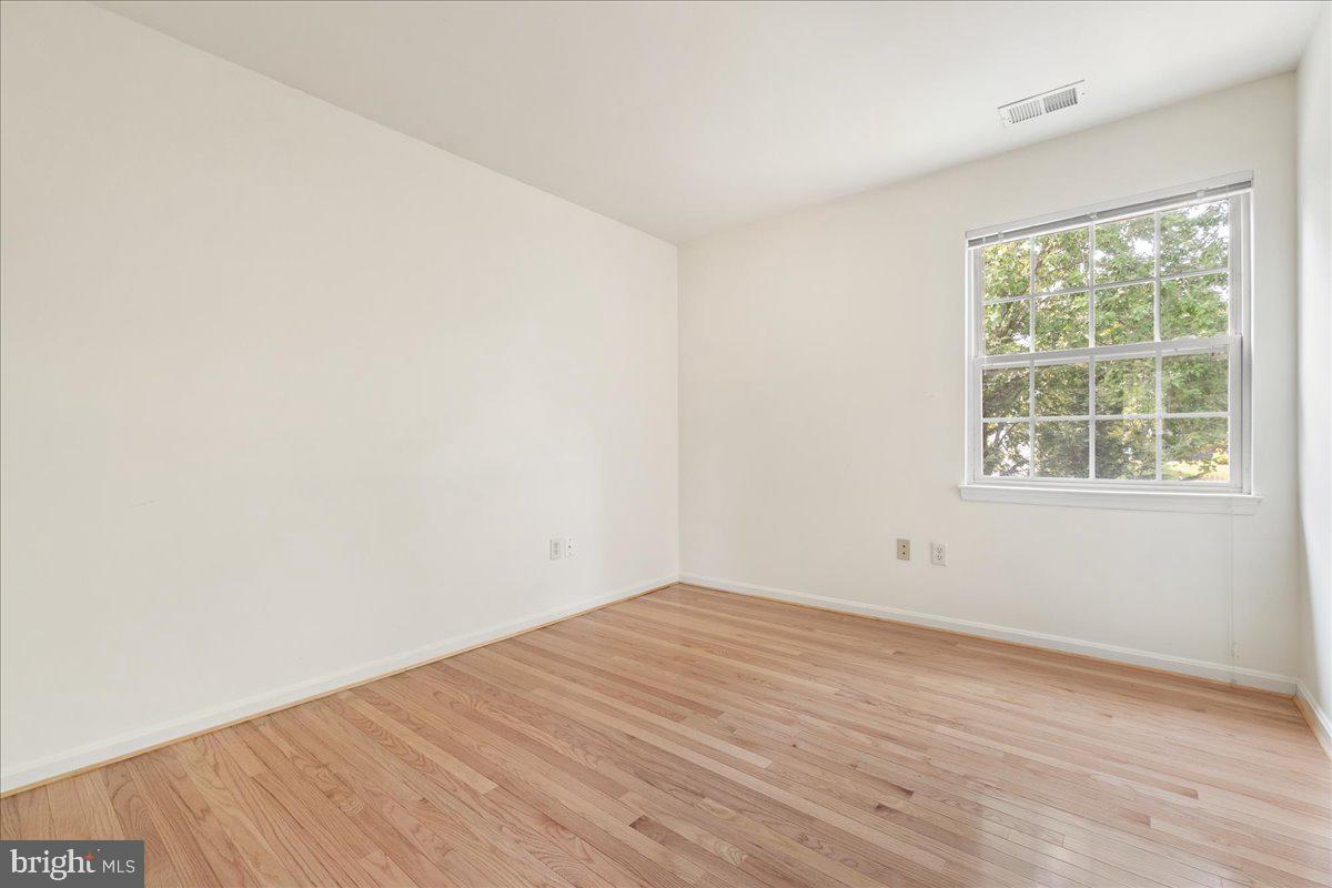 1712 Wheyfield Drive Frederick, MD 21701 - Photo 24 of 64 an empty room with wooden floor and windows