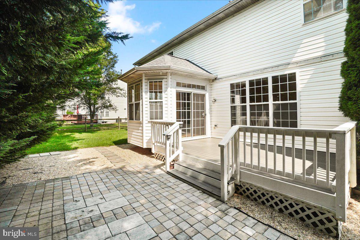 1712 Wheyfield Drive Frederick, MD 21701 - Photo 48 of 64 a porch with a bench next to yard