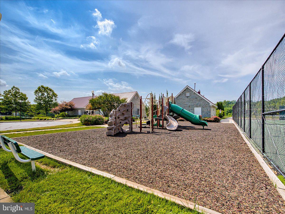1712 Wheyfield Drive Frederick, MD 21701 - Photo 50 of 64 a view of a park with swings and slides
