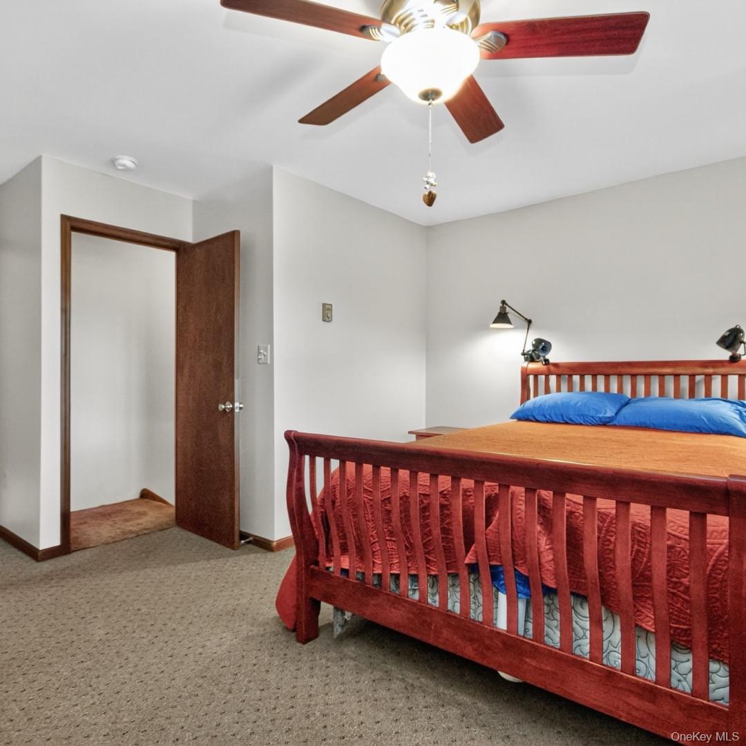 69 Crabby Road Loch Sheldrake, NY 12759 - Photo 14 of 20 a bed sitting in a room next to a window