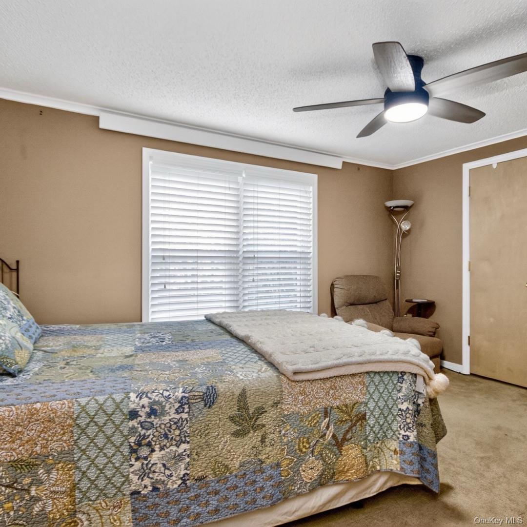 69 Crabby Road Loch Sheldrake, NY 12759 - Photo 16 of 20 a bedroom with a bed and a window