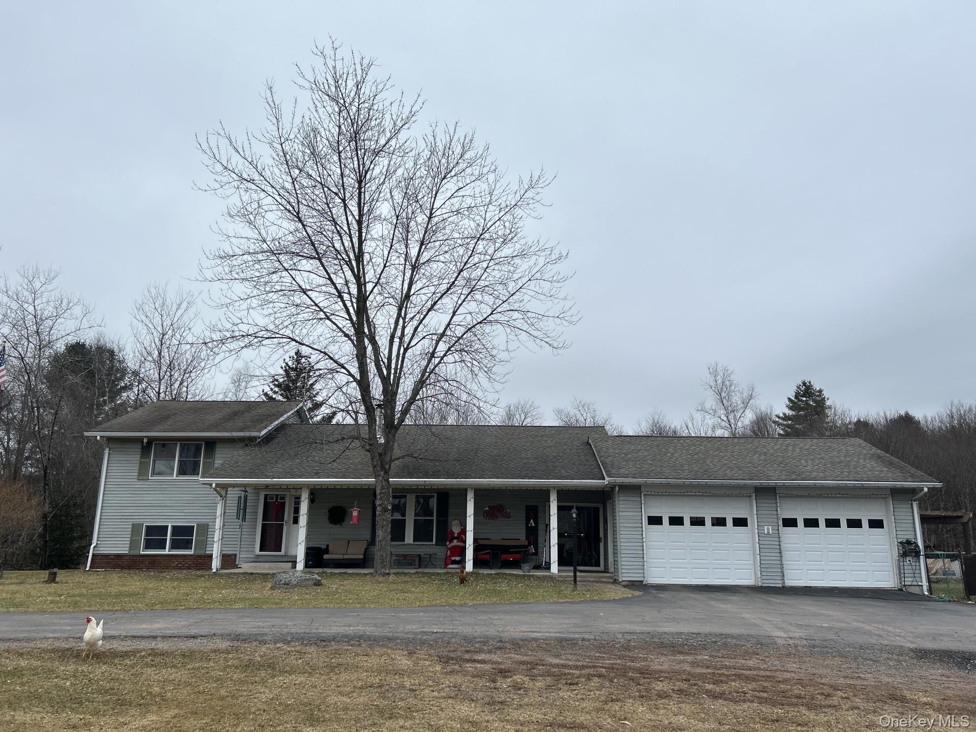 69 Crabby Road Loch Sheldrake, NY 12759 - Photo 2 of 20 a front view of a building with a ocean view