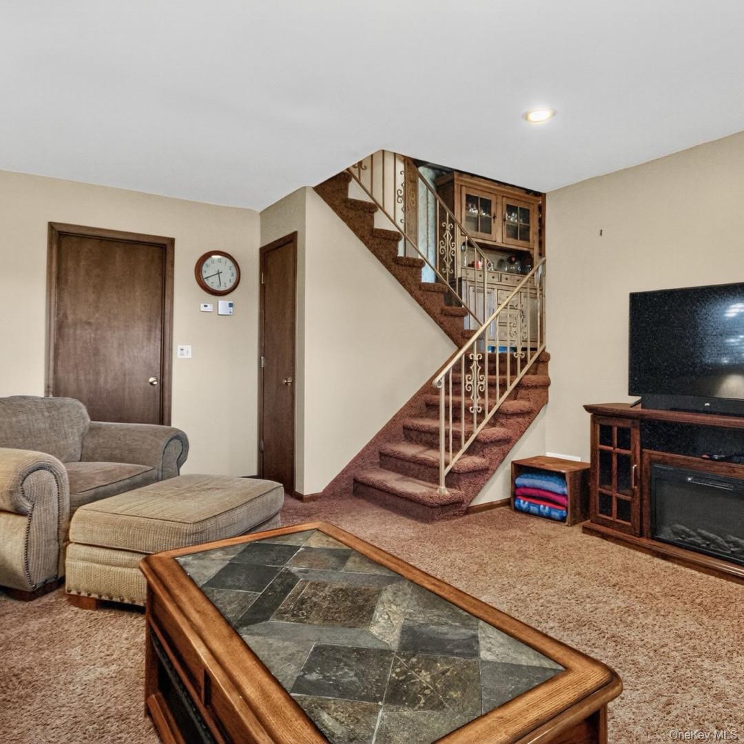 69 Crabby Road Loch Sheldrake, NY 12759 - Photo 8 of 20 a living room with furniture and a flat screen tv