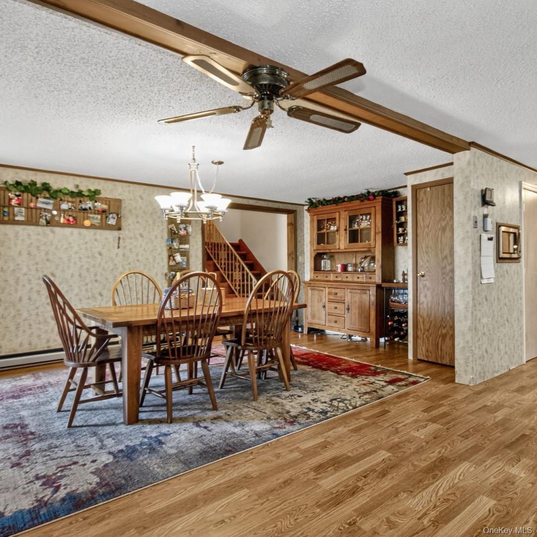 69 Crabby Road Loch Sheldrake, NY 12759 - Photo 9 of 20 a view of a dining room with furniture