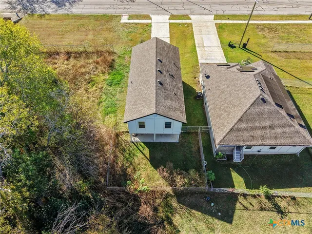 a aerial view of a house with a swimming pool