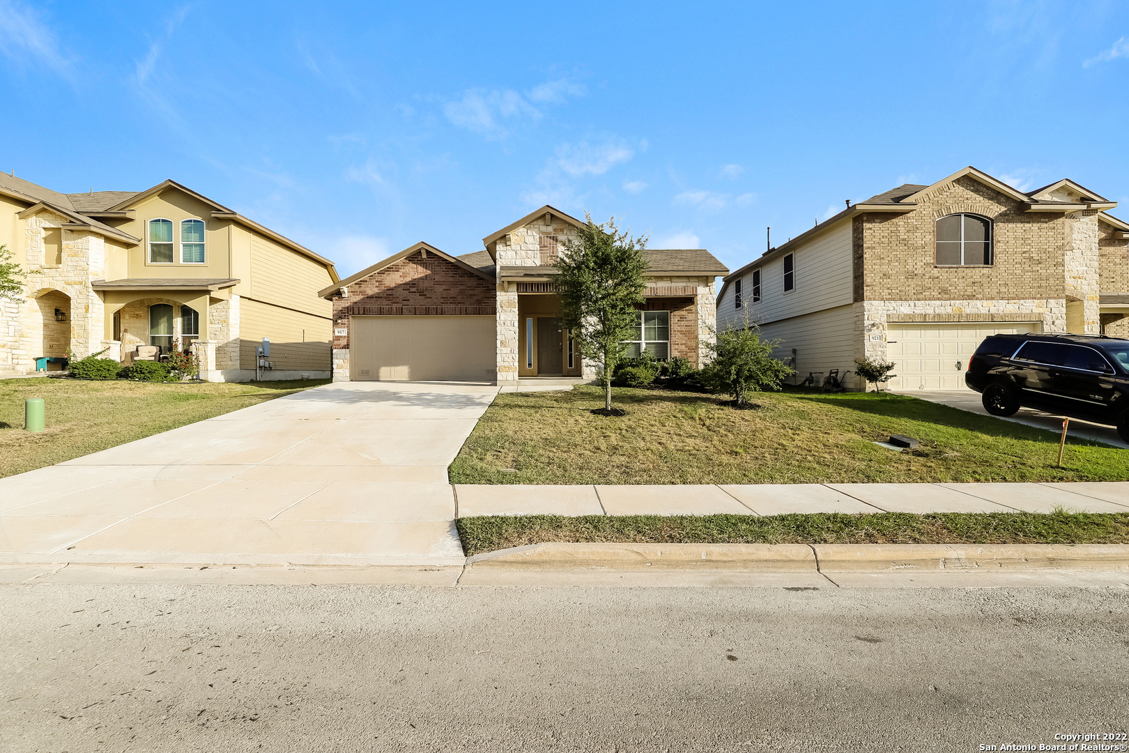 a front view of a house with a yard