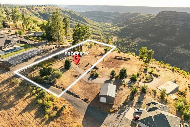 an aerial view of a house with a lake view