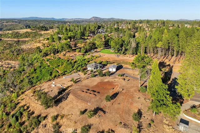 an aerial view of a house with a garden