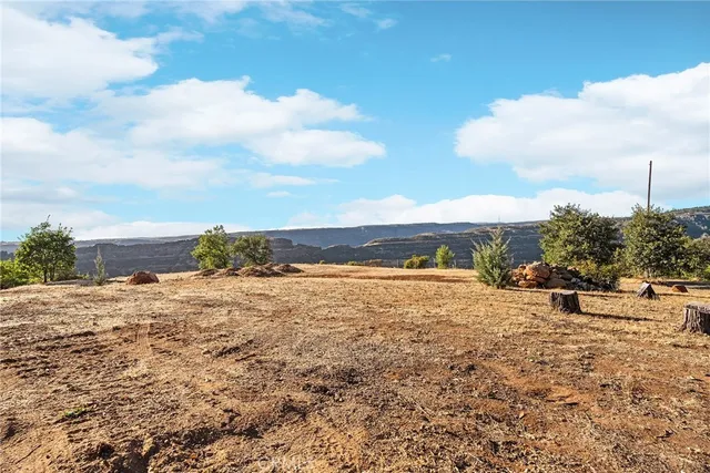 a view of a ocean beach and city