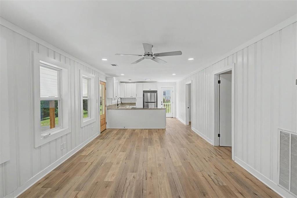 2115 King Road Dalton, GA 30720 - Photo 16 of 54 a view of a kitchen with wooden floor and a window