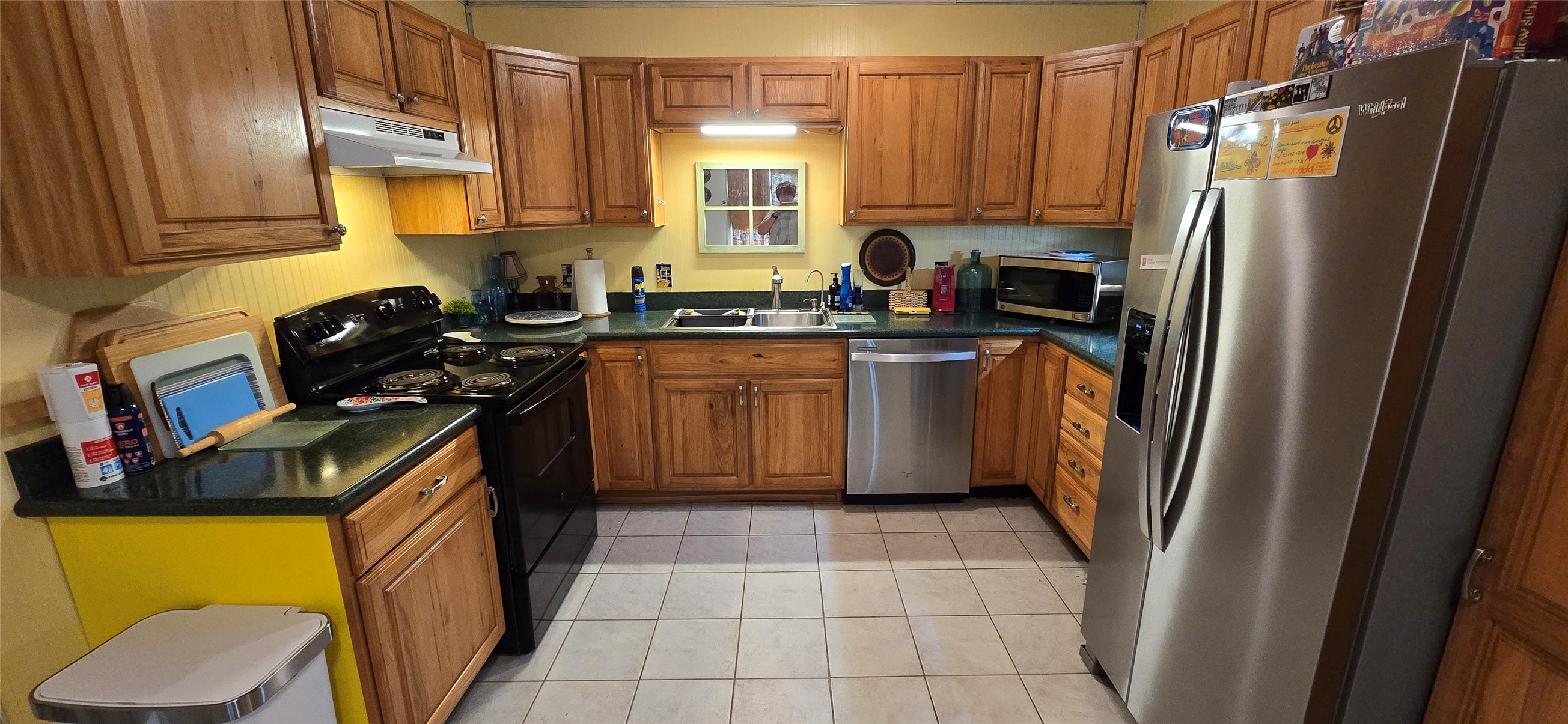 17018 Water Oak Drive Channelview, TX 77530 - Photo 15 of 40 a kitchen with a sink appliances and cabinets