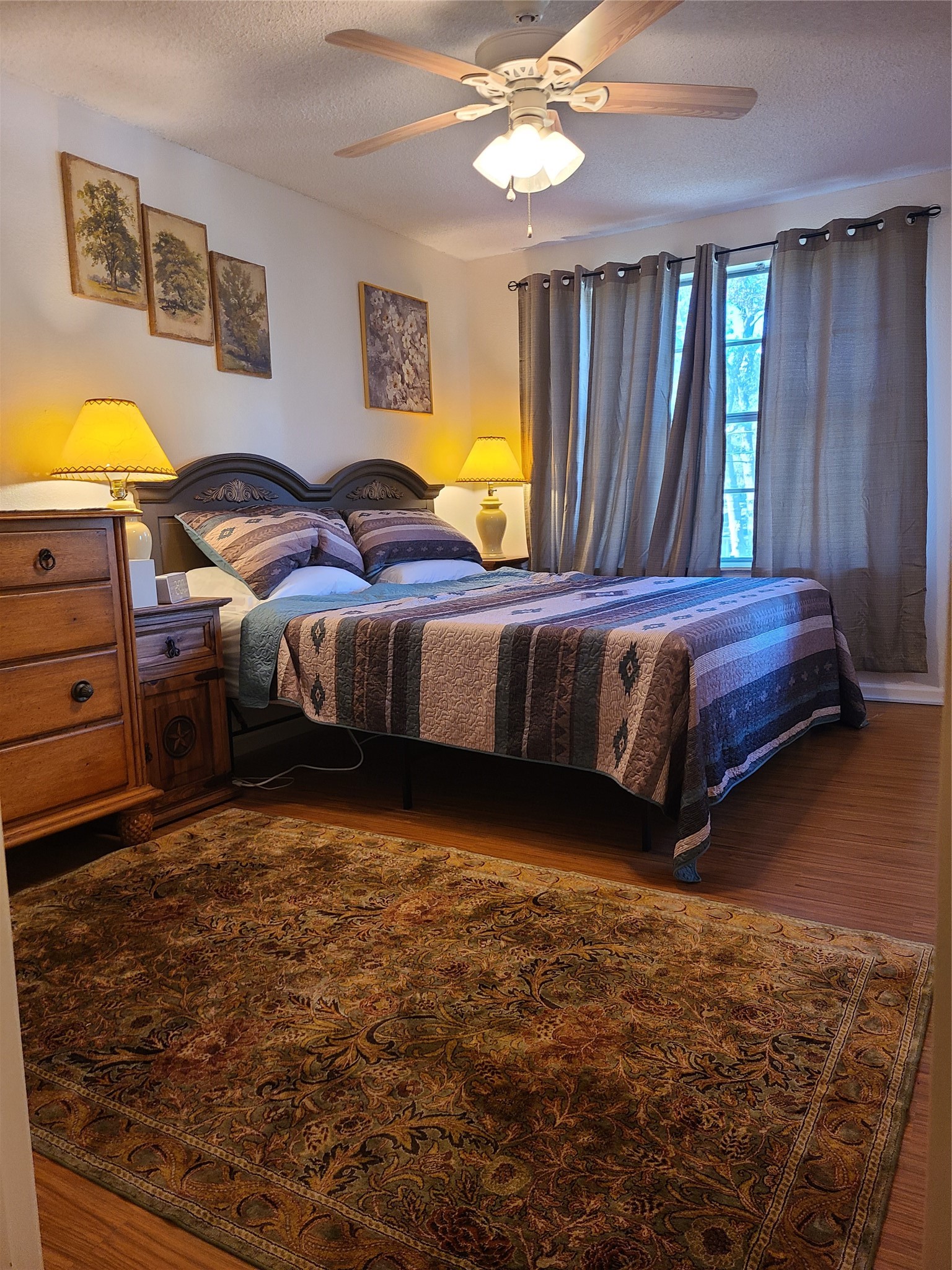 17018 Water Oak Drive Channelview, TX 77530 - Photo 24 of 40 a spacious bedroom with a bed and wooden floor