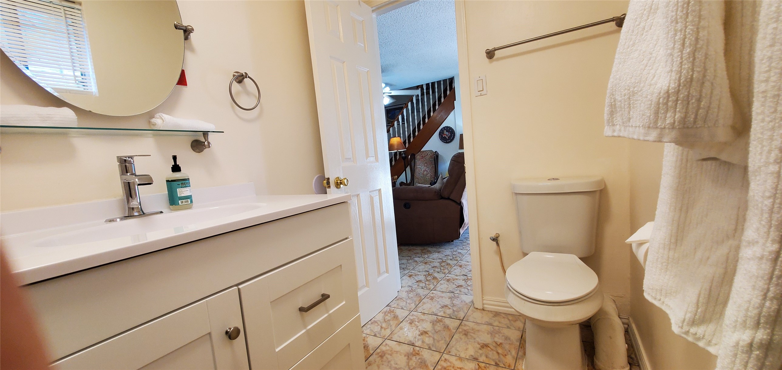 17018 Water Oak Drive Channelview, TX 77530 - Photo 28 of 40 a bathroom with a toilet a sink and a mirror