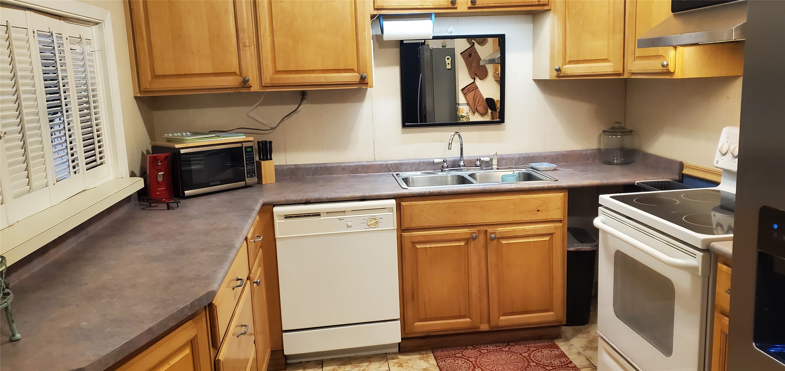 17018 Water Oak Drive Channelview, TX 77530 - Photo 31 of 40 a kitchen with a sink and a stove top oven