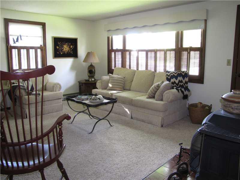 12 Indian Ridge Street Augusta, ME 04330 - Photo 6 of 25 Living Room. Hardwood flooring under...