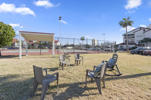 a view of houses with an outdoor space and seating area