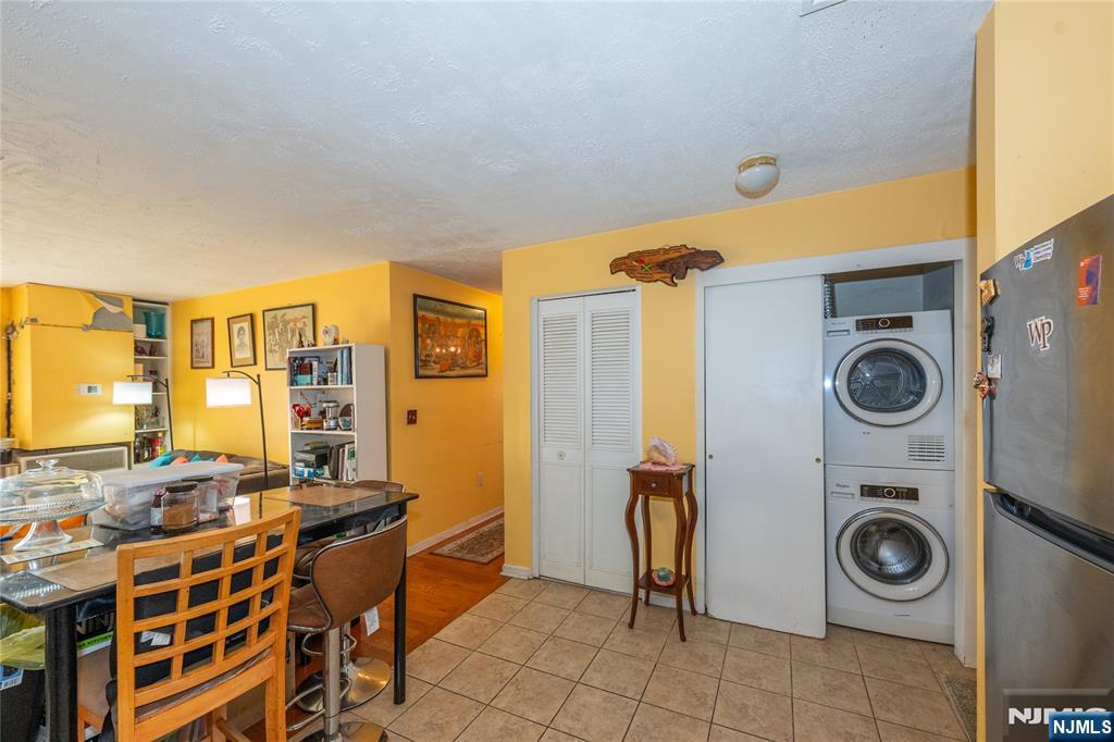 75 Union Street, Unit 5E Hackensack, NJ 07601 - Photo 11 of 24 a view of a bedroom with washer and dryer