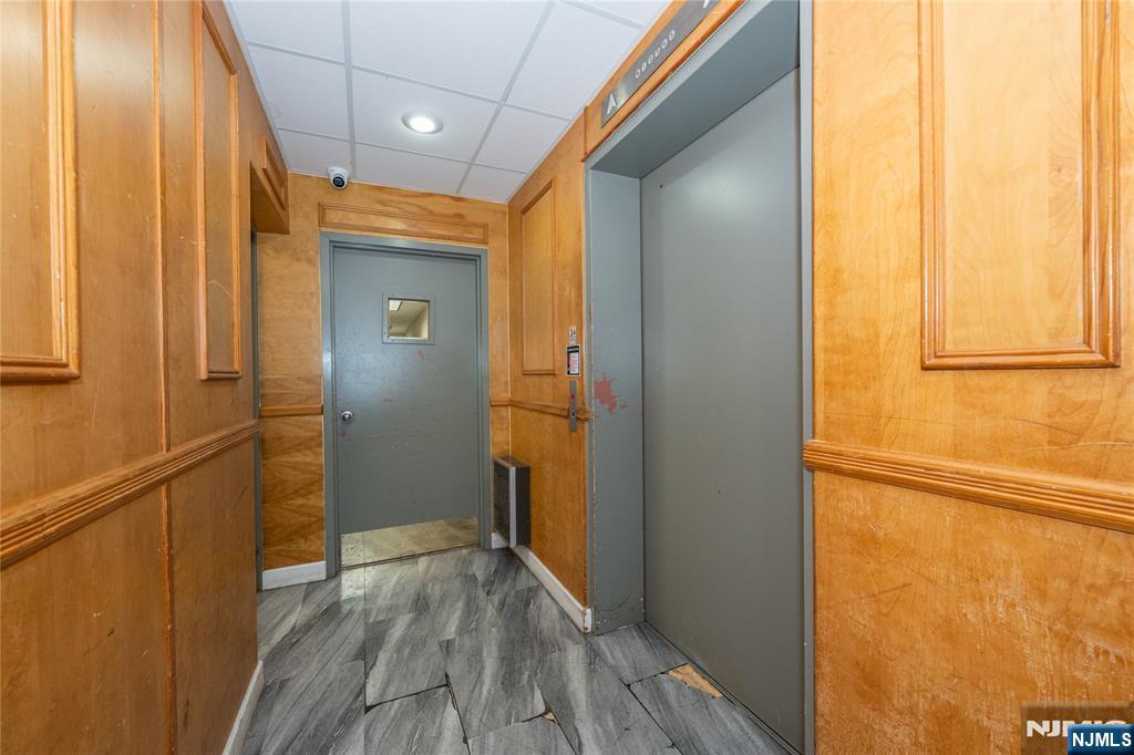 75 Union Street, Unit 5E Hackensack, NJ 07601 - Photo 7 of 24 a view of a hallway with wooden floor and staircase