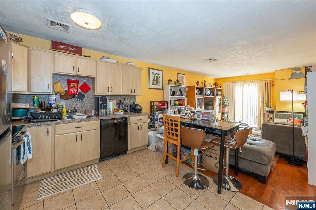 75 Union Street, Unit 5E Hackensack, NJ 07601 - Photo 8 of 24 a kitchen that has a lot of cabinets in it and appliances