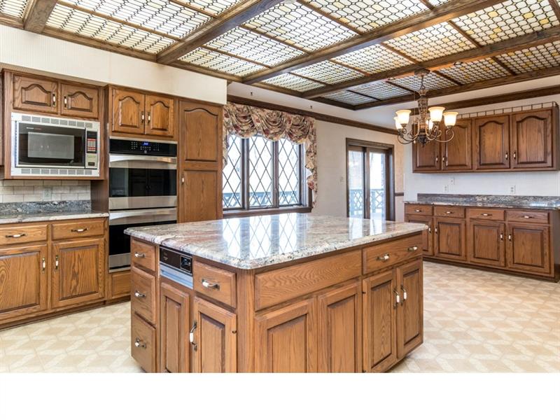 714 Clearfield Road Fenelton, PA 16034 - Photo 5 of 25 Large kitchen featuring granite counter tops and sliding door to wrap around deck.