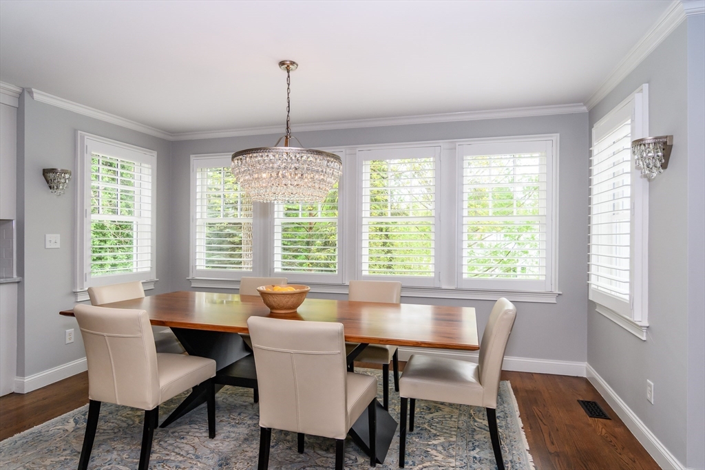 1098 Webster Street Needham, MA 02492 - Photo 4 of 21 a dining room with furniture a chandelier and wooden floor