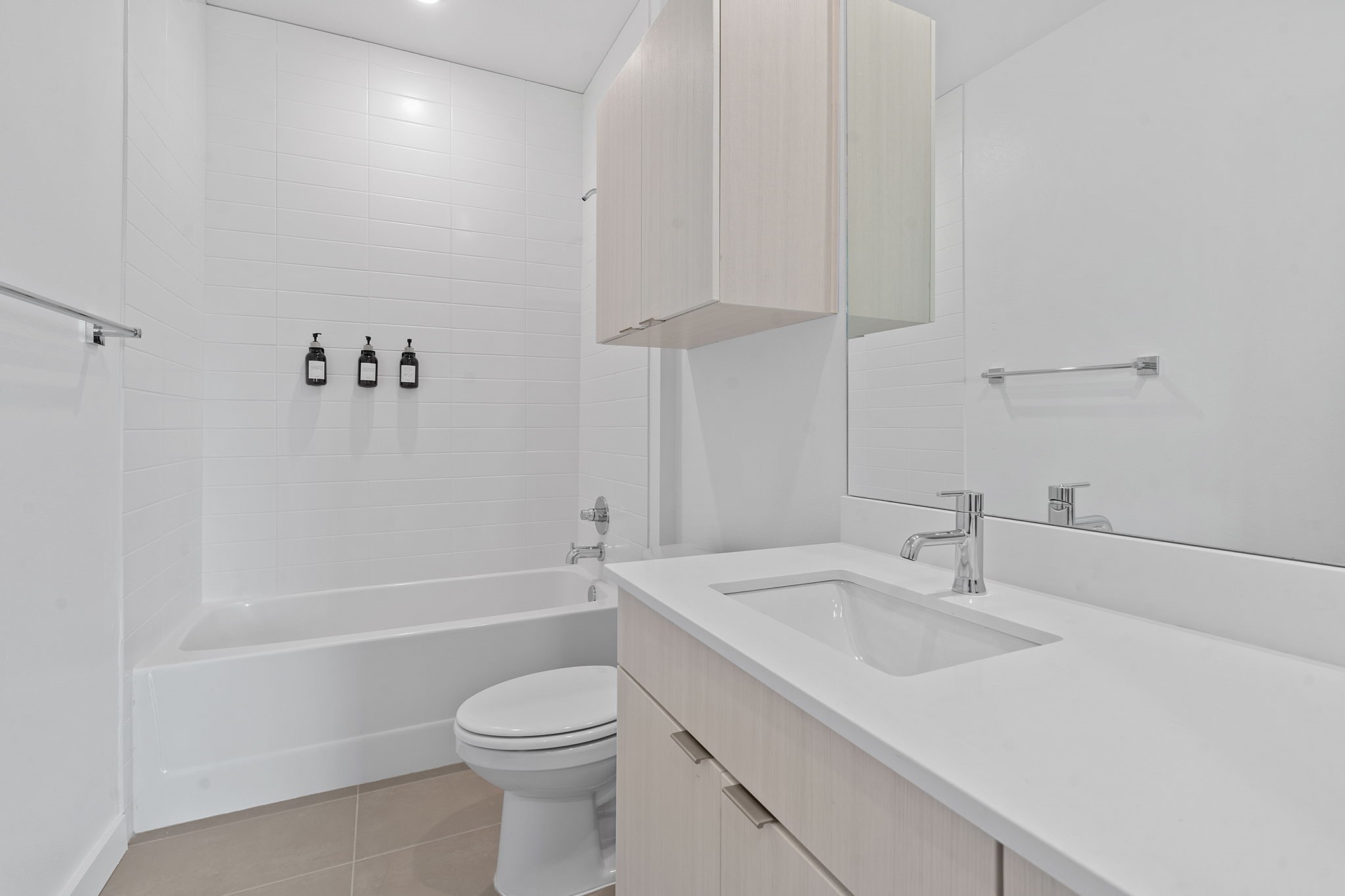 4802 South Congress Avenue, Unit 311 Austin, TX 78745 - Photo 12 of 18 a bathroom with a sink a toilet and shower