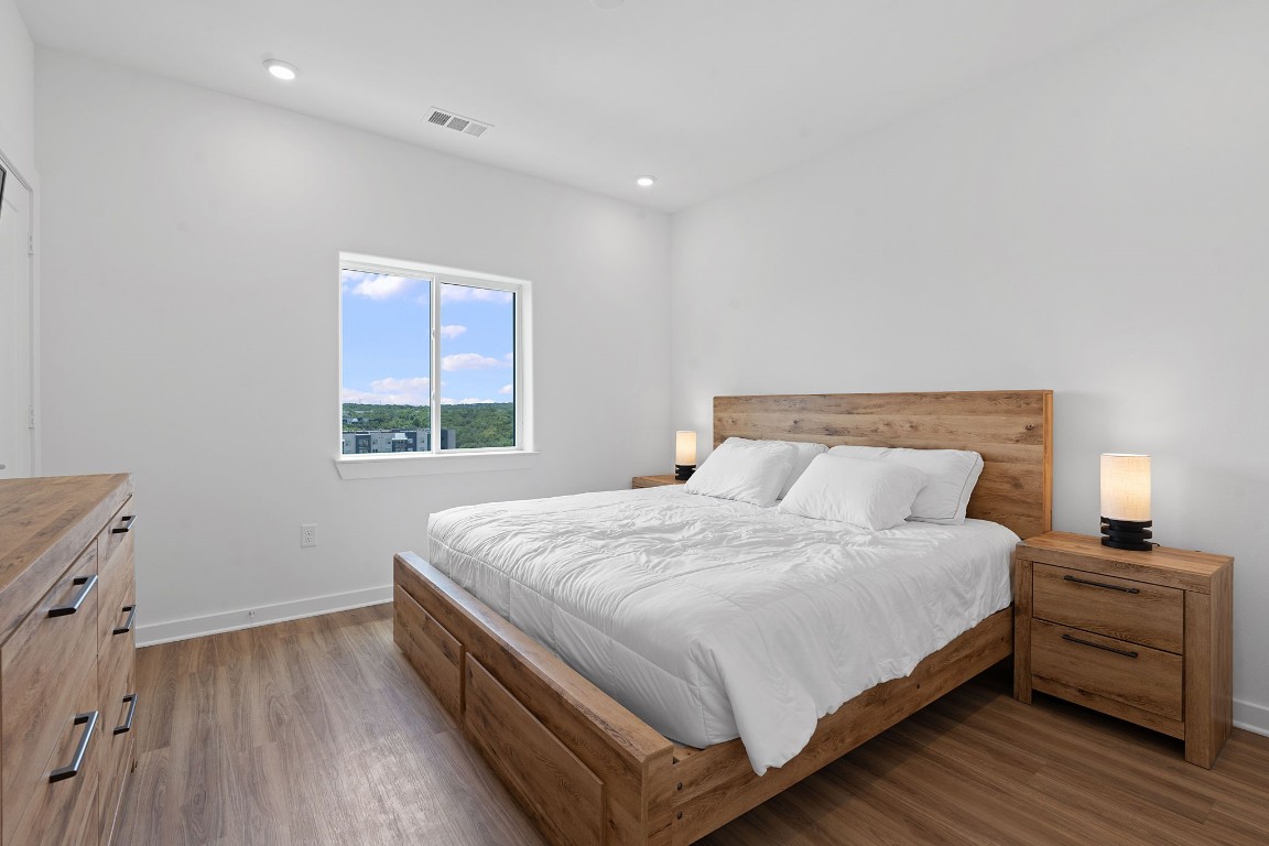 4802 South Congress Avenue, Unit 311 Austin, TX 78745 - Photo 8 of 18 a bedroom with a bed and a window