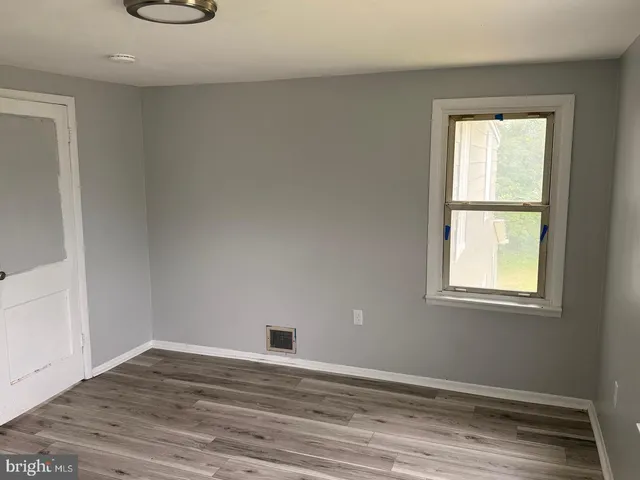 a kitchen with a sink a stove and cabinets