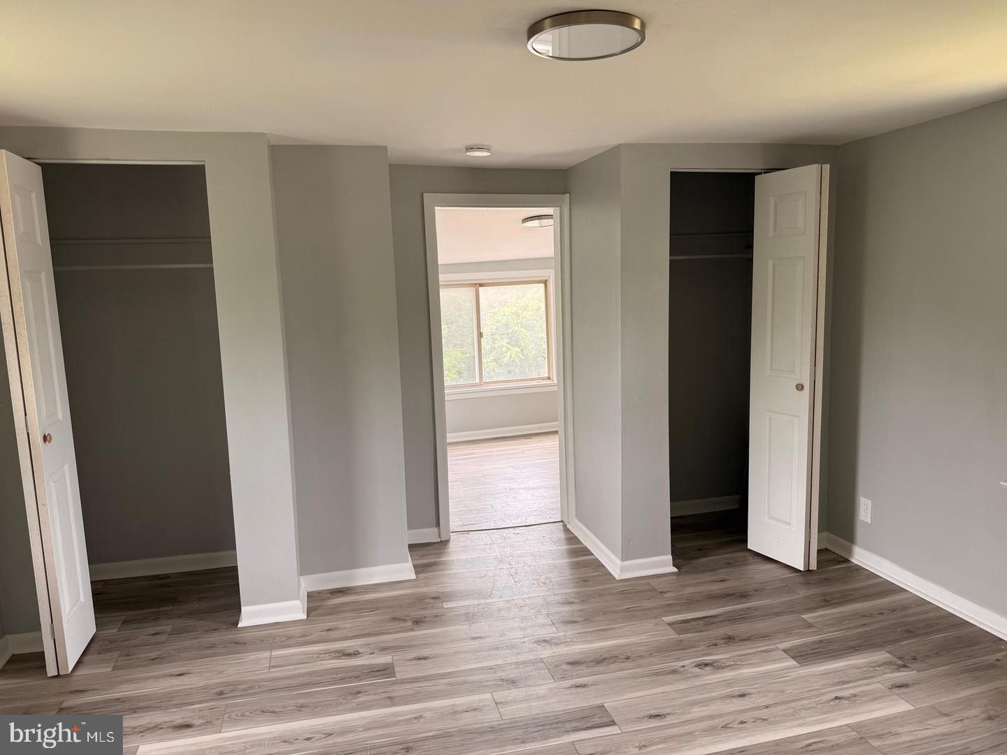 217 Smith Street Salem, NJ 08079 - Photo 17 of 23 an empty room with wooden floor and windows
