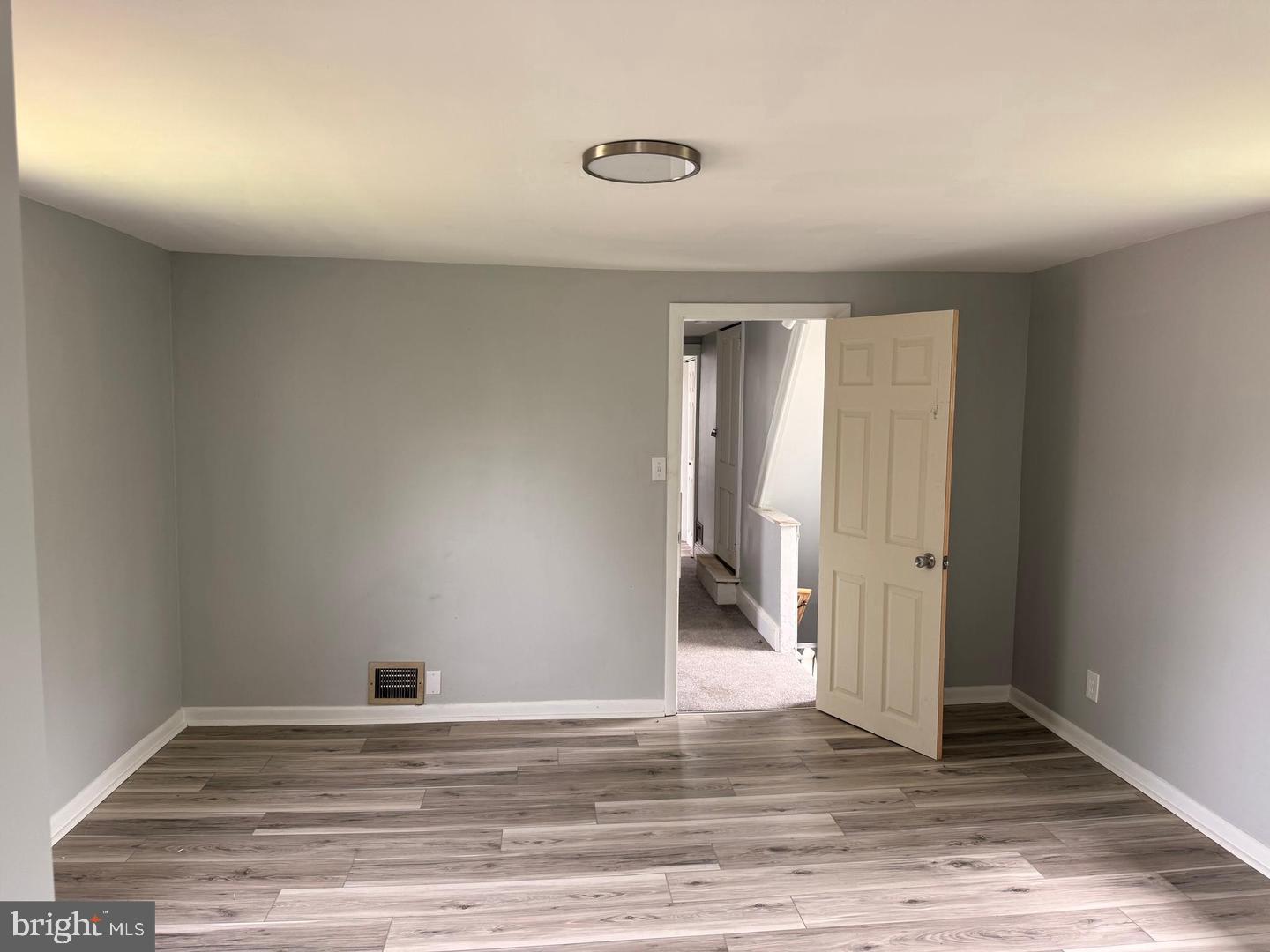 217 Smith Street Salem, NJ 08079 - Photo 18 of 23 a view of a livingroom with wooden floor and window