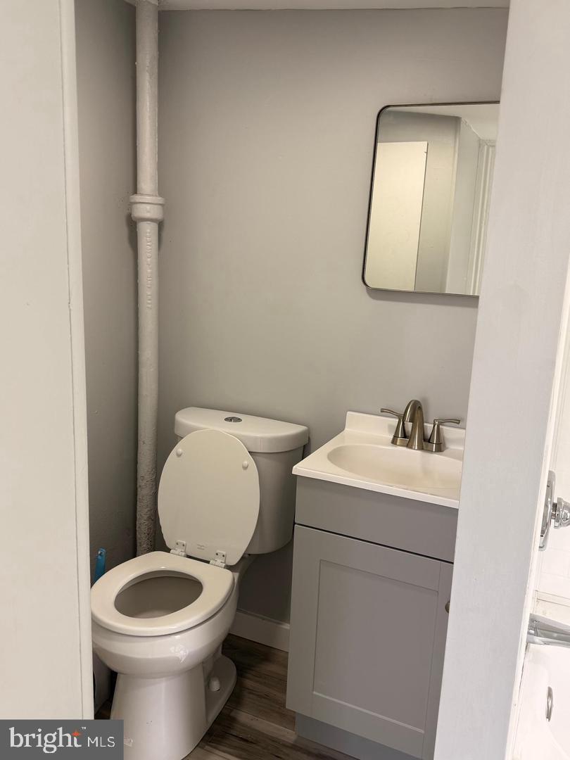 217 Smith Street Salem, NJ 08079 - Photo 19 of 23 a white toilet sitting next to a bathroom sink