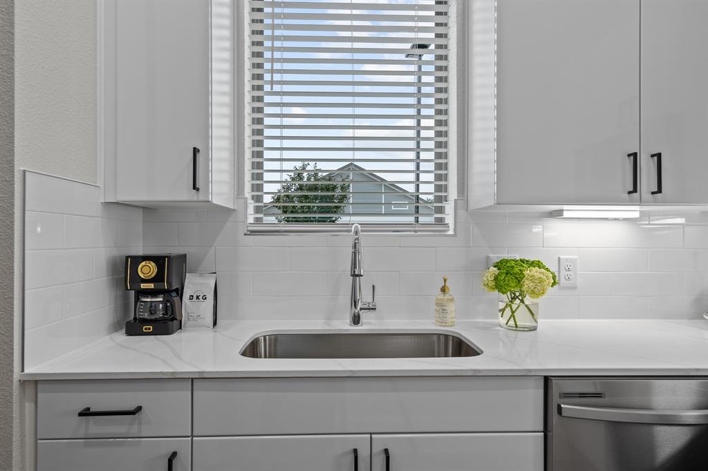 3272 Ganzer Road West, Unit 103B Denton, TX 76207 - Photo 12 of 25 a kitchen with a sink and window