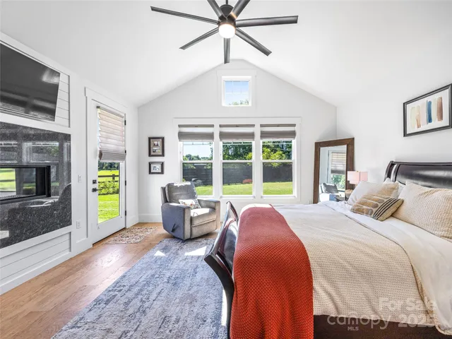 a bed room with a bed and a window